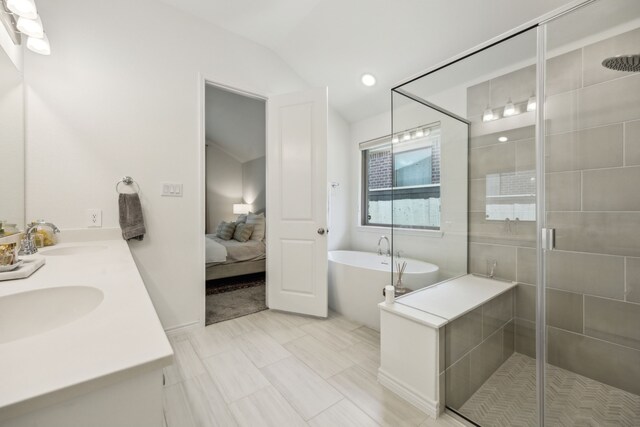 2812 Quill Ln, Northlake, TX 76247 - bathroom with a freestanding tub, a shower stall, ensuite bath, double vanity, and lofted ceiling