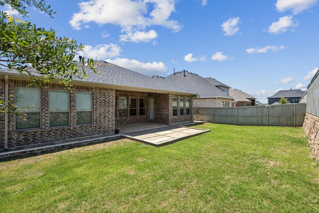 2812 Quill Ln, Northlake, TX 76247 - rear view of house with brick siding, a patio, and a shingled roof