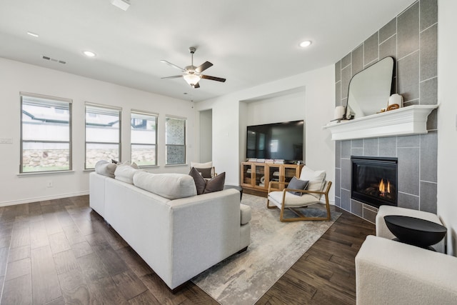 2812 Quill Ln, Northlake, TX 76247 - living room featuring a tiled fireplace, a ceiling fan, recessed lighting, dark wood finished floors, and baseboards