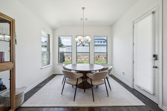 2812 Quill Ln, Northlake, TX 76247 - dining room with a chandelier, lofted ceiling, dark wood-type flooring, and baseboards
