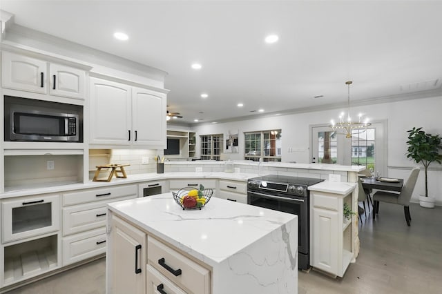 1430 Black Hawk Trl, Nemo, TX 76070 - kitchen featuring appliances with stainless steel finishes, a peninsula, a kitchen island, decorative backsplash, and a chandelier