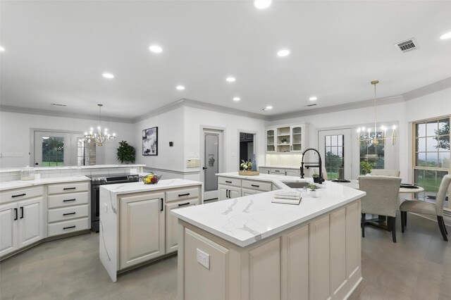 1430 Black Hawk Trl, Nemo, TX 76070 - kitchen with a large island, a chandelier, a sink, ornamental molding, and recessed lighting