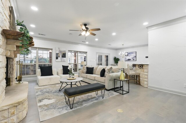 1430 Black Hawk Trl, Nemo, TX 76070 - living area with crown molding, ceiling fan, a chandelier, wood finished floors, and recessed lighting
