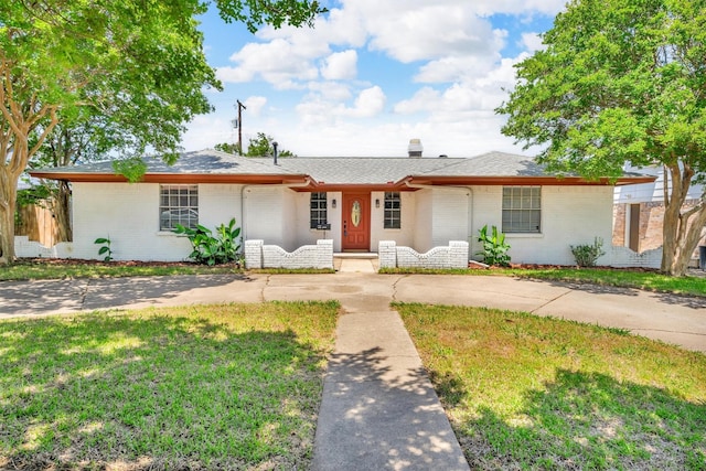 4109 Twin Falls St, Irving, TX 75062 - ranch-style home featuring a front yard and brick siding