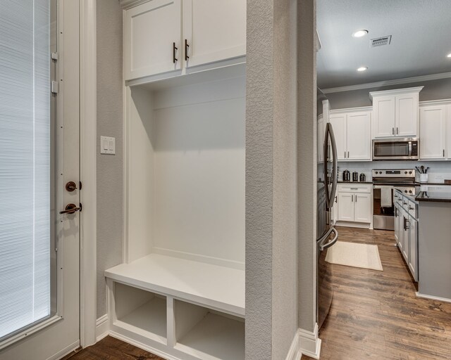 513 Dillon St, Waxahachie, TX 75165 - mudroom featuring ornamental molding, dark wood finished floors, and recessed lighting
