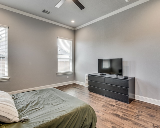 513 Dillon St, Waxahachie, TX 75165 - bedroom with ornamental molding, wood finished floors, baseboards, a ceiling fan, and recessed lighting