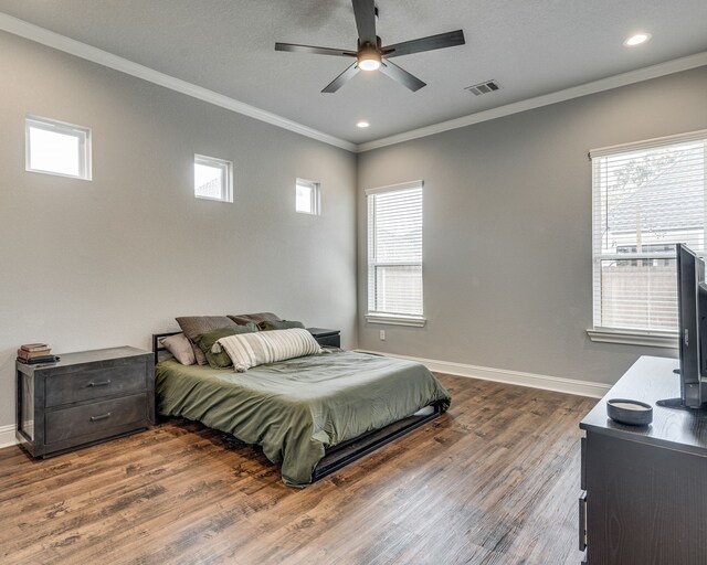 513 Dillon St, Waxahachie, TX 75165 - bedroom featuring crown molding, wood finished floors, multiple windows, baseboards, and recessed lighting