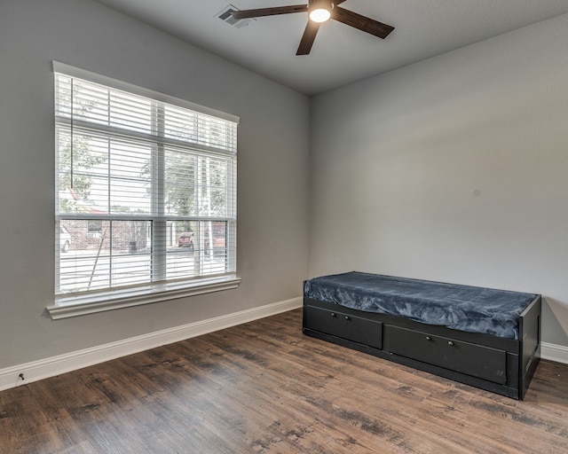 513 Dillon St, Waxahachie, TX 75165 - bedroom with multiple windows, baseboards, and wood finished floors