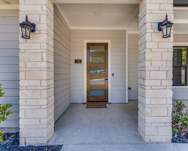 513 Dillon St, Waxahachie, TX 75165 - doorway to property with stone siding