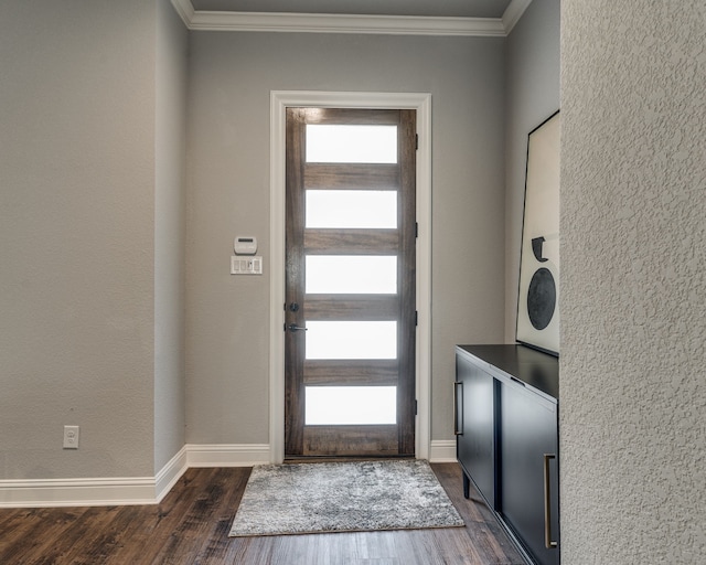513 Dillon St, Waxahachie, TX 75165 - foyer entrance featuring ornamental molding, dark wood finished floors, and baseboards