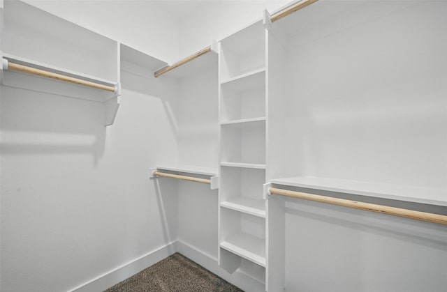 2734 W Washington St, Denison, TX 75020 - walk in closet featuring dark carpet