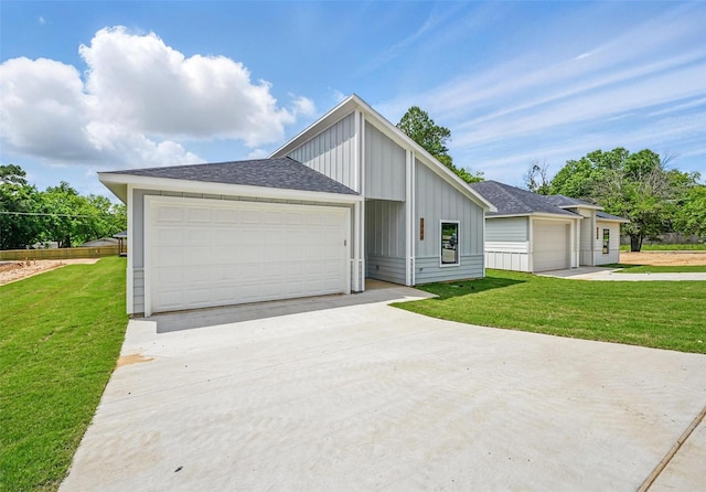 2734 W Washington St, Denison, TX 75020 - view of front facade featuring a front lawn, board and batten siding, and a shingled roof