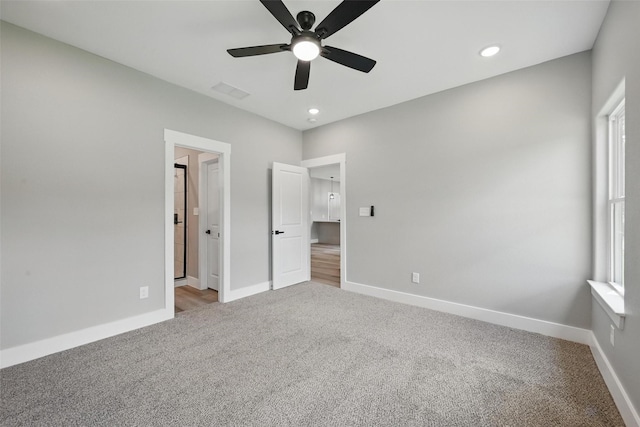 2734 W Washington St, Denison, TX 75020 - unfurnished bedroom featuring carpet floors, baseboards, recessed lighting, and a ceiling fan
