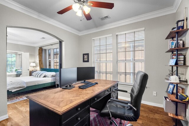 office with wood finished floors, ceiling fan, arched walkways, crown molding, and baseboards