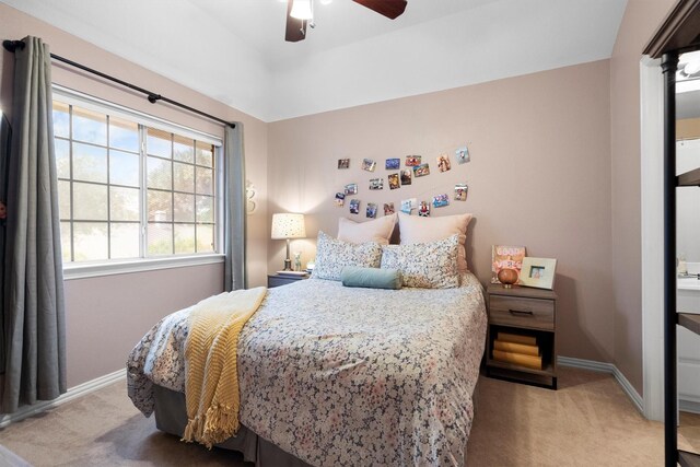 bedroom with carpet, baseboards, and a ceiling fan
