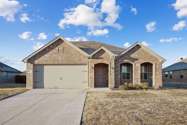 107 Mesa Verde Ct, Forney, TX 75126 - view of front of house with brick siding, concrete driveway, and a garage