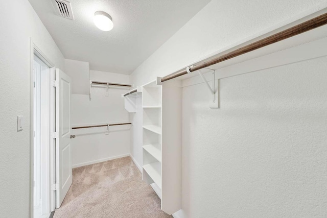107 Mesa Verde Ct, Forney, TX 75126 - walk in closet featuring light colored carpet