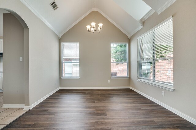 5504 Seneca Dr, Plano, TX 75094 - unfurnished room featuring healthy amount of natural light, arched walkways, a chandelier, and lofted ceiling