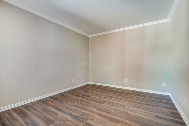5504 Seneca Dr, Plano, TX 75094 - spare room featuring dark wood-style flooring, baseboards, and crown molding