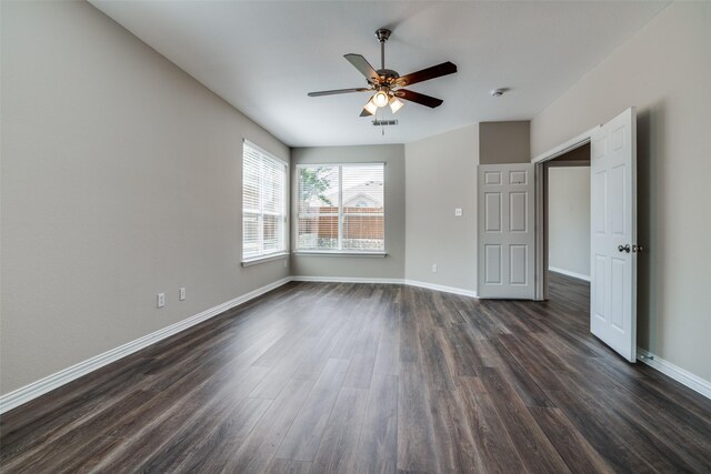 5504 Seneca Dr, Plano, TX 75094 - unfurnished bedroom featuring dark wood finished floors, baseboards, and ceiling fan