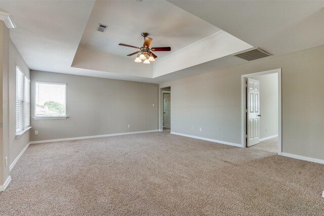 5504 Seneca Dr, Plano, TX 75094 - empty room featuring a tray ceiling, ceiling fan, carpet flooring, and baseboards