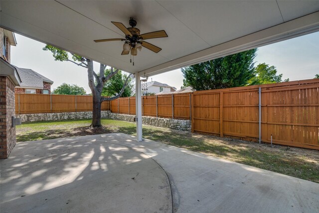 5504 Seneca Dr, Plano, TX 75094 - view of patio with a ceiling fan and a fenced backyard