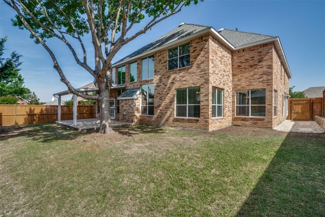 5504 Seneca Dr, Plano, TX 75094 - back of house featuring a patio, brick siding, and a gate