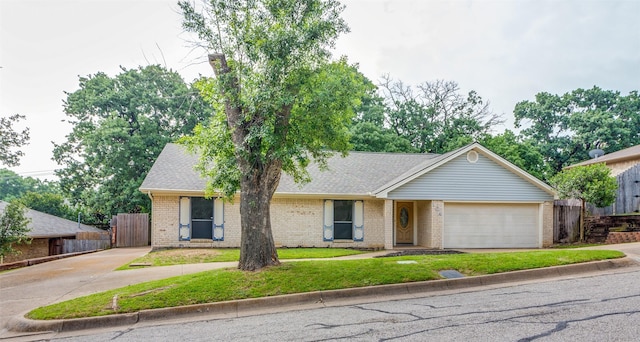 104 NE Rosamond St, Burleson, TX 76028 - view of front of house featuring brick siding, concrete driveway, an attached garage, and a shingled roof