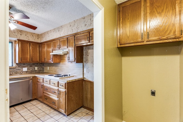 104 NE Rosamond St, Burleson, TX 76028 - kitchen featuring dishwasher, white cooktop, ceiling fan, under cabinet range hood, and brown cabinetry