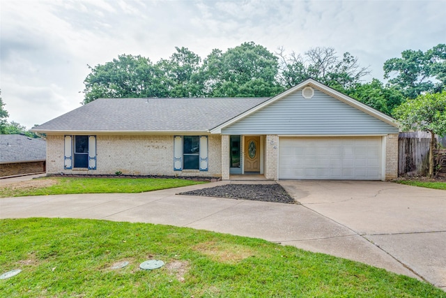 104 NE Rosamond St, Burleson, TX 76028 - view of front of house featuring concrete driveway, an attached garage, brick siding, and roof with shingles