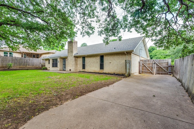 104 NE Rosamond St, Burleson, TX 76028 - rear view of property with brick siding, a gate, a chimney, a shingled roof, and a patio