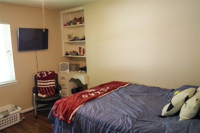 124 Circle Dr, Kaufman, TX 75142 - bedroom featuring wood finished floors and baseboards