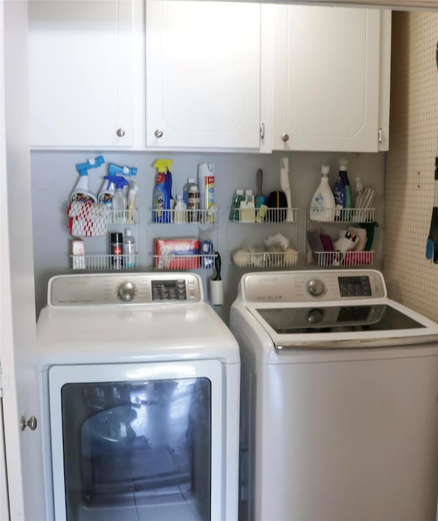 124 Circle Dr, Kaufman, TX 75142 - clothes washing area featuring washing machine and clothes dryer and cabinet space