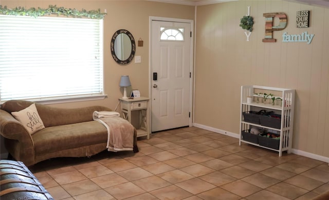 124 Circle Dr, Kaufman, TX 75142 - entryway featuring light tile patterned floors, plenty of natural light, baseboards, and crown molding