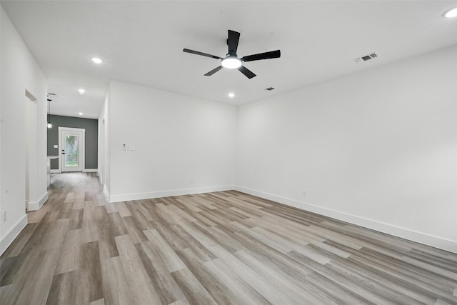912 Layne Dr, Denison, TX 75020 - empty room featuring light wood-style floors, recessed lighting, a ceiling fan, and baseboards