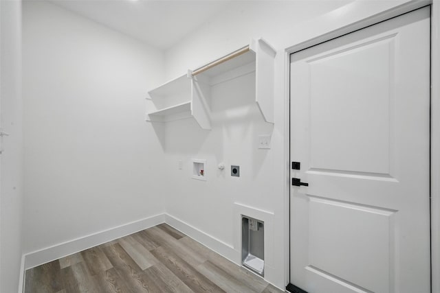 912 Layne Dr, Denison, TX 75020 - laundry room featuring hookup for an electric dryer, wood finished floors, hookup for a washing machine, baseboards, and gas dryer hookup