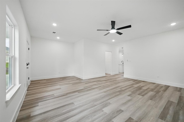 912 Layne Dr, Denison, TX 75020 - empty room with light wood-type flooring, recessed lighting, a ceiling fan, and baseboards