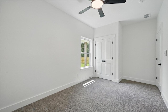 912 Layne Dr, Denison, TX 75020 - unfurnished bedroom with carpet floors, baseboards, and ceiling fan