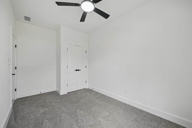 912 Layne Dr, Denison, TX 75020 - spare room with dark colored carpet, ceiling fan, and baseboards