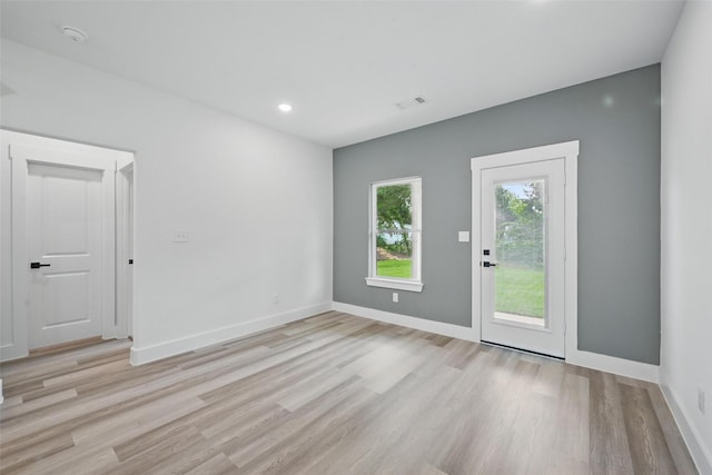 912 Layne Dr, Denison, TX 75020 - unfurnished room featuring light wood-type flooring, baseboards, and recessed lighting