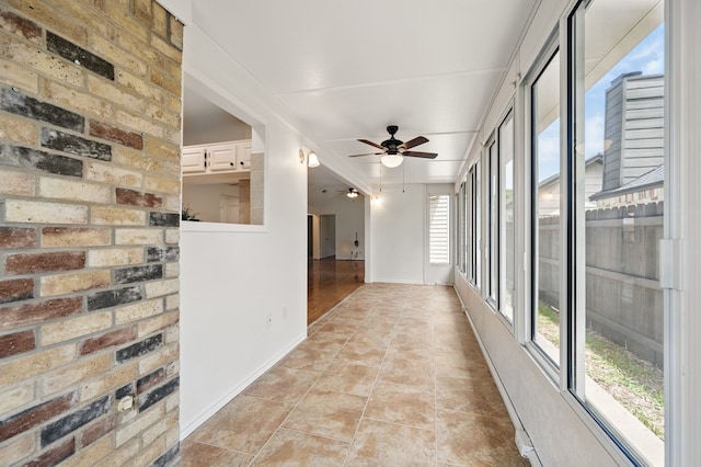 hallway featuring baseboards