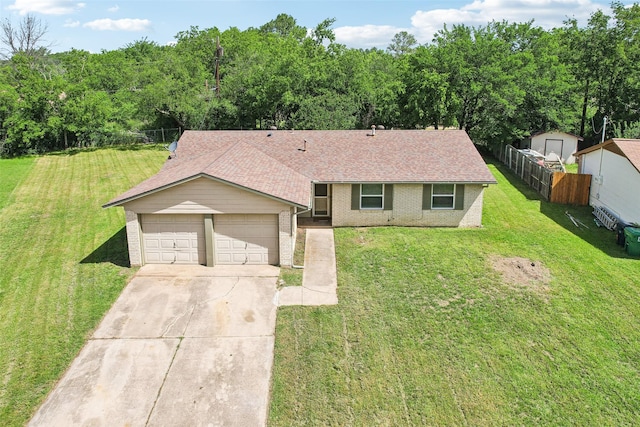 207 Bluebird Cir, Denton, TX 76209 - ranch-style house with brick siding, concrete driveway, roof with shingles, and a garage