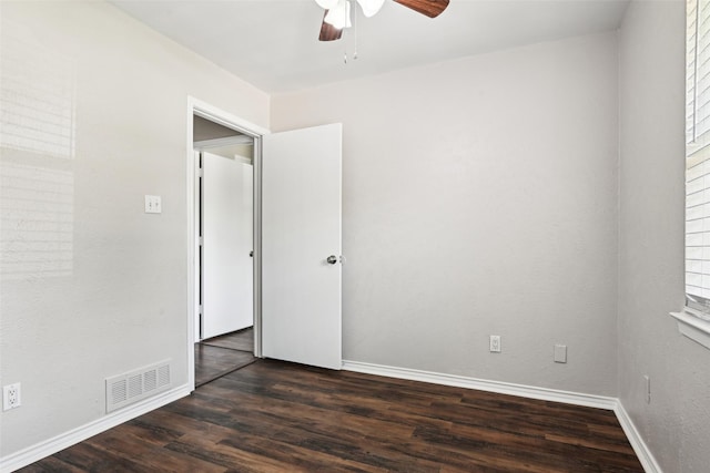 207 Bluebird Cir, Denton, TX 76209 - unfurnished room with a ceiling fan, dark wood-style floors, and baseboards