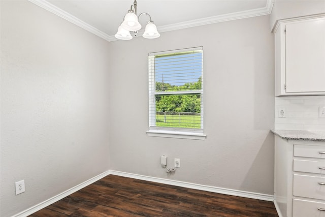 207 Bluebird Cir, Denton, TX 76209 - unfurnished dining area featuring healthy amount of natural light, a chandelier, ornamental molding, baseboards, and dark wood-style flooring