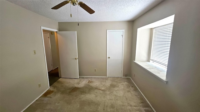 18 E Townhouse Ln Unit 31, Grand Prairie, TX 75052 - unfurnished bedroom with carpet, a textured ceiling, baseboards, and ceiling fan