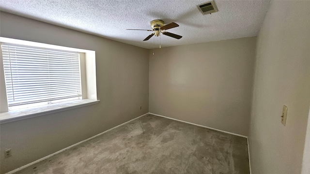 18 E Townhouse Ln Unit 31, Grand Prairie, TX 75052 - carpeted spare room with ceiling fan, baseboards, and a textured ceiling