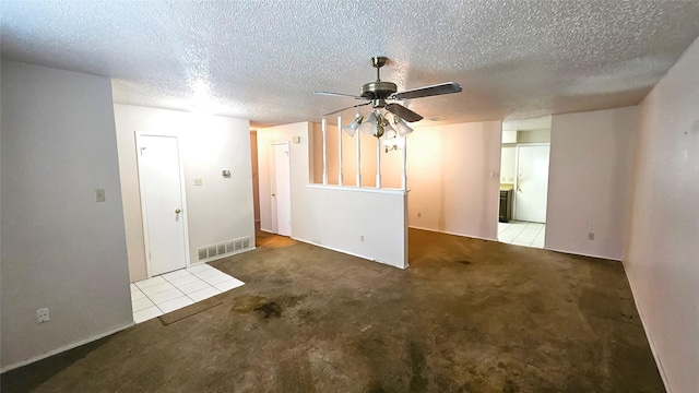 18 E Townhouse Ln Unit 31, Grand Prairie, TX 75052 - carpeted spare room with ceiling fan and a textured ceiling