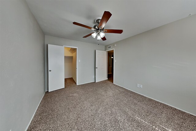 1625 Stockton Trl, Plano, TX 75023 - unfurnished bedroom featuring a spacious closet, carpet floors, baseboards, ceiling fan, and a closet