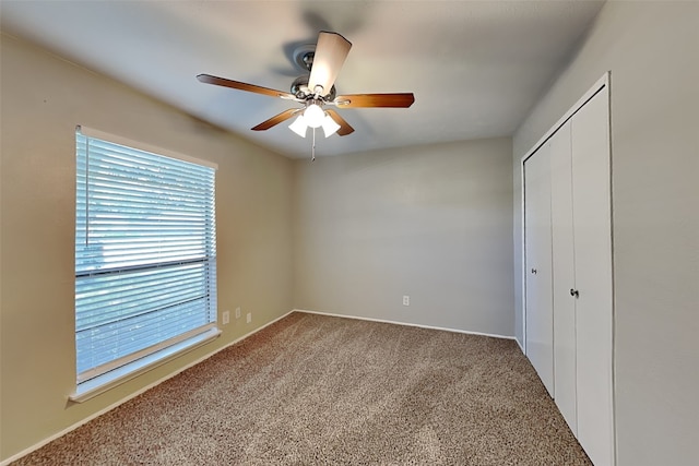 1625 Stockton Trl, Plano, TX 75023 - unfurnished bedroom with carpet floors, a closet, a ceiling fan, and baseboards