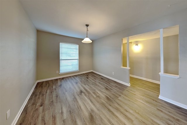 1625 Stockton Trl, Plano, TX 75023 - spare room with wood finished floors and baseboards
